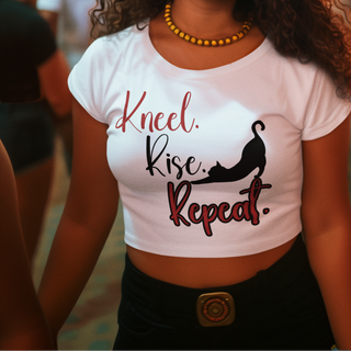 Woman wearing a white t-shirt with text at a festive event with colorful flags.